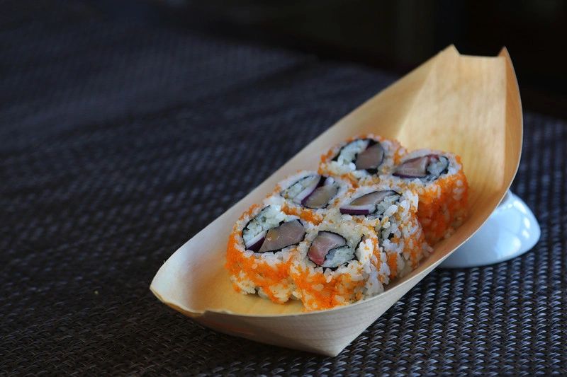 Yum Yum Roll Yellowtail, onion, masago, and sesame oil